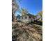 Side view of a renovated white house with landscaping at 445 N Dunn St, Angier, NC 27501