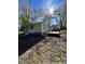 Back of house showing deck and mature landscaping at 445 N Dunn St, Angier, NC 27501