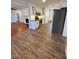 Modern kitchen with white cabinets, granite countertops, and stainless steel appliances at 445 N Dunn St, Angier, NC 27501