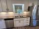 Modern kitchen with granite countertops and stainless steel appliances at 445 N Dunn St, Angier, NC 27501