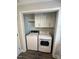 Convenient laundry room with washer, dryer, and storage cabinets at 445 N Dunn St, Angier, NC 27501
