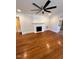 Living room with hardwood floors, fireplace and ceiling fan at 445 N Dunn St, Angier, NC 27501