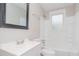 Simple bathroom with white fixtures and shower/tub at 4505 Laymans Chapel Rd, Durham, NC 27704