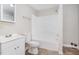 Clean bathroom with a shower/tub combo and white vanity at 4505 Laymans Chapel Rd, Durham, NC 27704