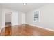 Spacious bedroom with hardwood floors and ample natural light at 4505 Laymans Chapel Rd, Durham, NC 27704