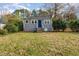 Charming gray house with a manicured lawn and trees at 4505 Laymans Chapel Rd, Durham, NC 27704