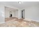 Open living room with view into kitchen and hallway at 4505 Laymans Chapel Rd, Durham, NC 27704