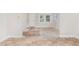 Open living area with damaged hardwood floors at 4505 Laymans Chapel Rd, Durham, NC 27704