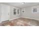 Living room with hardwood floors and large windows at 4505 Laymans Chapel Rd, Durham, NC 27704