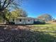 Ranch style home features a spacious front yard at 465 N Dunn St, Angier, NC 27501