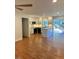 Open concept living area with kitchen and hardwood floors at 465 N Dunn St, Angier, NC 27501