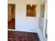 Sunroom with built-in shelving and access to kitchen at 465 N Dunn St, Angier, NC 27501