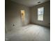 Unfinished bedroom with window and sunlight at 9618 Stallings Rd, Spring Hope, NC 27882