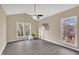 Cozy living room with vaulted ceilings, ample natural light, and wood-look flooring at 110 Modena Dr, Cary, NC 27513