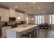 Modern kitchen with island, stainless steel appliances, and white cabinets at 129 Callowhill Ln, Durham, NC 27713