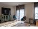 Living room with TV, two chairs, and a cabinet at 129 Callowhill Ln, Durham, NC 27713