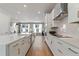 Contemporary kitchen with white cabinets, stainless steel appliances, and large island at 1500 Village Hall Ln # 39, Wake Forest, NC 27587