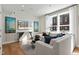 Spacious living room with large windows, hardwood floors, and comfortable seating at 1500 Village Hall Ln # 39, Wake Forest, NC 27587