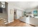 Finished basement with light hardwood floors, large sectional sofa, and built-in shelving at 1508 Village Hall Ln, Wake Forest, NC 27587