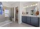 Double vanity bathroom with shower and toilet at 1508 Village Hall Ln, Wake Forest, NC 27587