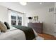 Bright bedroom with large windows and dresser at 1508 Village Hall Ln, Wake Forest, NC 27587