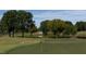 Scenic golf course with pond and lush trees at 1508 Village Hall Ln, Wake Forest, NC 27587