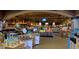 Interior view of a well-stocked grocery store with various food items and wine on display at 1508 Village Hall Ln, Wake Forest, NC 27587