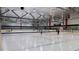 Indoor ice skating rink with hockey nets and skaters at 1508 Village Hall Ln, Wake Forest, NC 27587