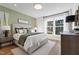 Spacious main bedroom with large windows and wood floors at 1508 Village Hall Ln, Wake Forest, NC 27587