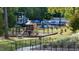 Community playground with slides, climbing structures, and picnic tables at 1508 Village Hall Ln, Wake Forest, NC 27587