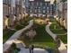 An inviting community featuring townhouses with landscaped grounds and a grilling area at 1508 Village Hall Ln, Wake Forest, NC 27587