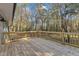 Wooden deck overlooking a wooded backyard at 1518 Parks Village Rd, Zebulon, NC 27597