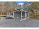 Gray house exterior with carport and gravel driveway at 1518 Parks Village Rd, Zebulon, NC 27597