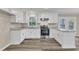 Newly renovated kitchen featuring white cabinets and granite countertops at 1518 Parks Village Rd, Zebulon, NC 27597