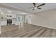 Open kitchen with white cabinets and granite countertops at 1518 Parks Village Rd, Zebulon, NC 27597