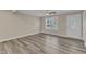 Living room featuring wood-look floors and neutral walls at 1518 Parks Village Rd, Zebulon, NC 27597