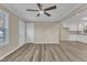 Living room with hardwood floors and view into kitchen at 1518 Parks Village Rd, Zebulon, NC 27597