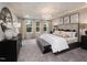 Spacious main bedroom with large windows and plush bedding at 212 Shingle Oak Rd, Wake Forest, NC 27587