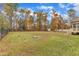 Large backyard with wooded area and fence at 37 Evie Dr, Smithfield, NC 27577