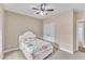 Bright bedroom with double doors leading to a laundry room at 37 Evie Dr, Smithfield, NC 27577