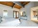 Bright main bedroom with wood ceilings, access to a deck, and ample space at 4824 Sandberry Ln, Raleigh, NC 27613