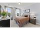 Cozy bedroom with a comfortable bed and plenty of natural light at 10529 Pleasant Branch Dr # 201, Raleigh, NC 27614