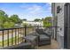 Relaxing deck with wicker furniture, overlooking a community of townhouses at 10529 Pleasant Branch Dr # 201, Raleigh, NC 27614