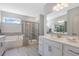 Modern bathroom with a soaking tub, walk-in shower, and double vanity at 109 Fairport Ln, Apex, NC 27539