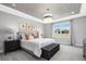 Cozy bedroom with patterned ceiling, plush bedding, and window seat at 109 Fairport Ln, Apex, NC 27539