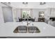 Modern kitchen island with double stainless steel sink and faucet at 109 Fairport Ln, Apex, NC 27539