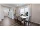 Bright dining area with hardwood floors and a large window at 1168 Maple Branch Cir, Graham, NC 27253