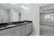 Bathroom with double vanity and view of bedroom at 129 Bowerbank Ln, Apex, NC 27539