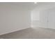 Large bedroom with carpeted floors and an additional door at 1680 Abberly Pl, Graham, NC 27253