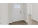 Spacious entryway with white door and wood-look flooring at 1680 Abberly Pl, Graham, NC 27253